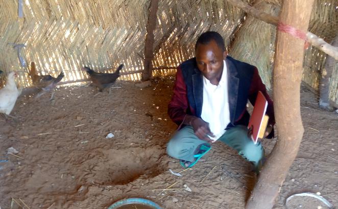 Bassirou Karbo with the chickens he raised while learning from another TLT trainee in Nigeria.