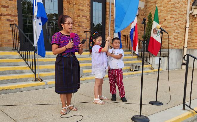 On the steps of Lee Street Christian Reformed Church, participants spoke about their Latin American homelands.