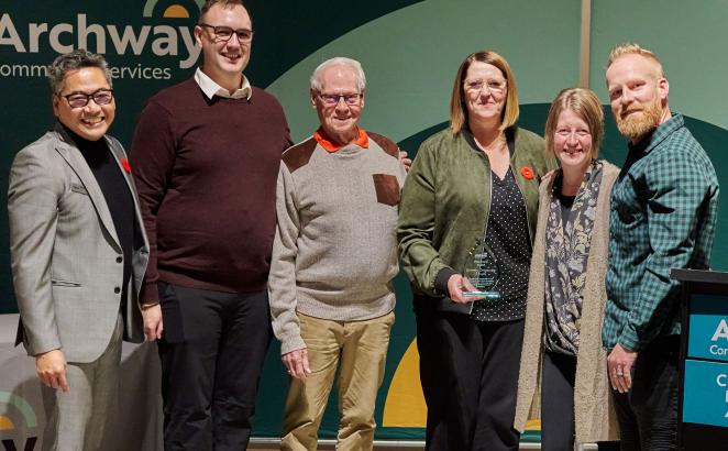 Members of Gateway Community Church receive the Flood Hero award from Archway Community Services CEO Ron Santiago (left).