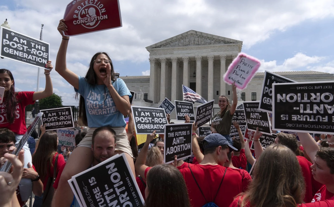 Anti-abortion protesters celebrate outside the Supreme Court in Washington on Friday, June 24, 2022. The Supreme Court has ended constitutional protections for abortion that had been in place nearly 50 years, a decision by its conservative majority to overturn the court's landmark abortion cases.