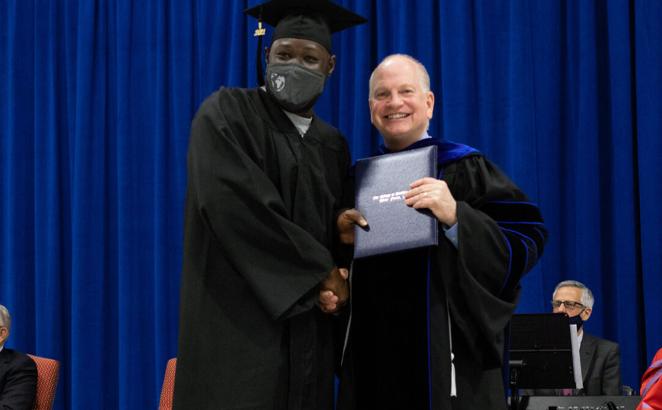 Danny Akin, right, poses with a graduate during the College at Southeastern graduation ceremony Dec. 15, 2021, at Nash Correctional Institution in Nashville, N.C. Photo courtesy of Southeastern Baptist Theological Seminary in Wake Forest, N.C.