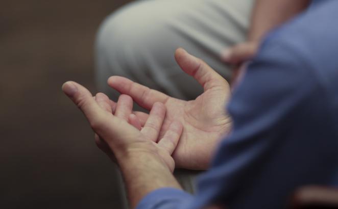 Hands in prayer, during Synod 2022.