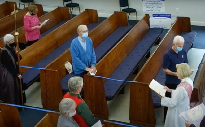 Socially distanced congregants attend a service at Holy Comforter Episcopal Church in Tallahassee, Fla., on Dec. 13, 2020. Video screengrab