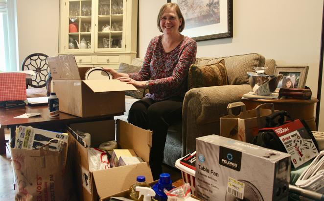 Amy Treier, at her home in the Chicago suburbs, is helping to store donations for World Relief welcome kits collected by members of Immanuel Presbyterian Church in Warrenville, Ill.