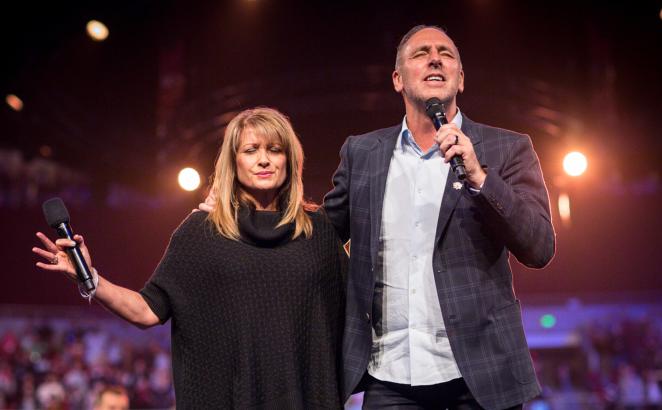 Senior Pastors Brian and Bobbie Houston in prayer at Hillsong Church. 