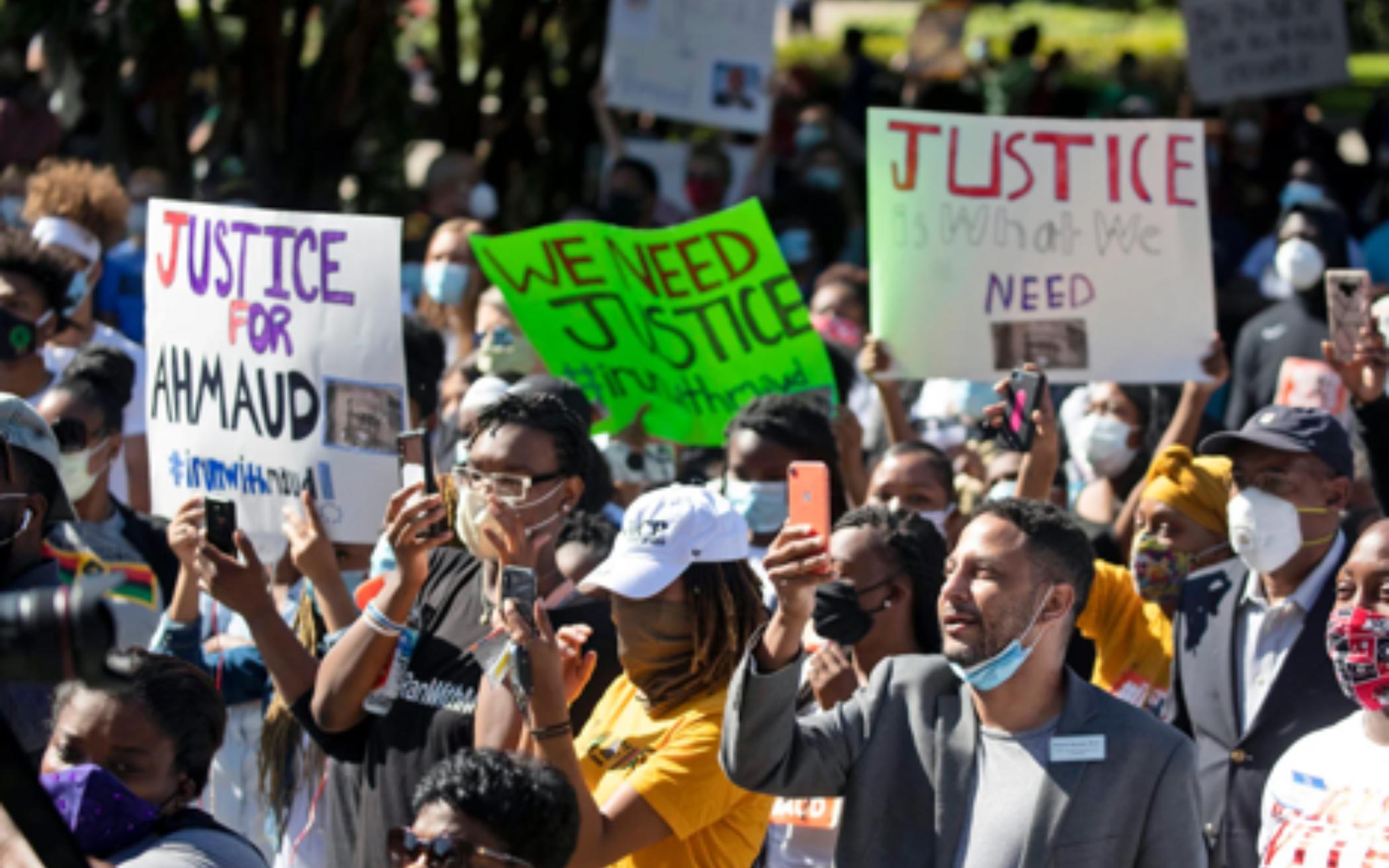 People participate in a rally May 8, 2020, in Brunswick, Georgia, to protest the killing of Ahmaud Arbery, an unarmed black man. Two men have been charged with murder in the February shooting death of Arbery, whom they had pursued in a truck after spotting him running in their neighborhood. 