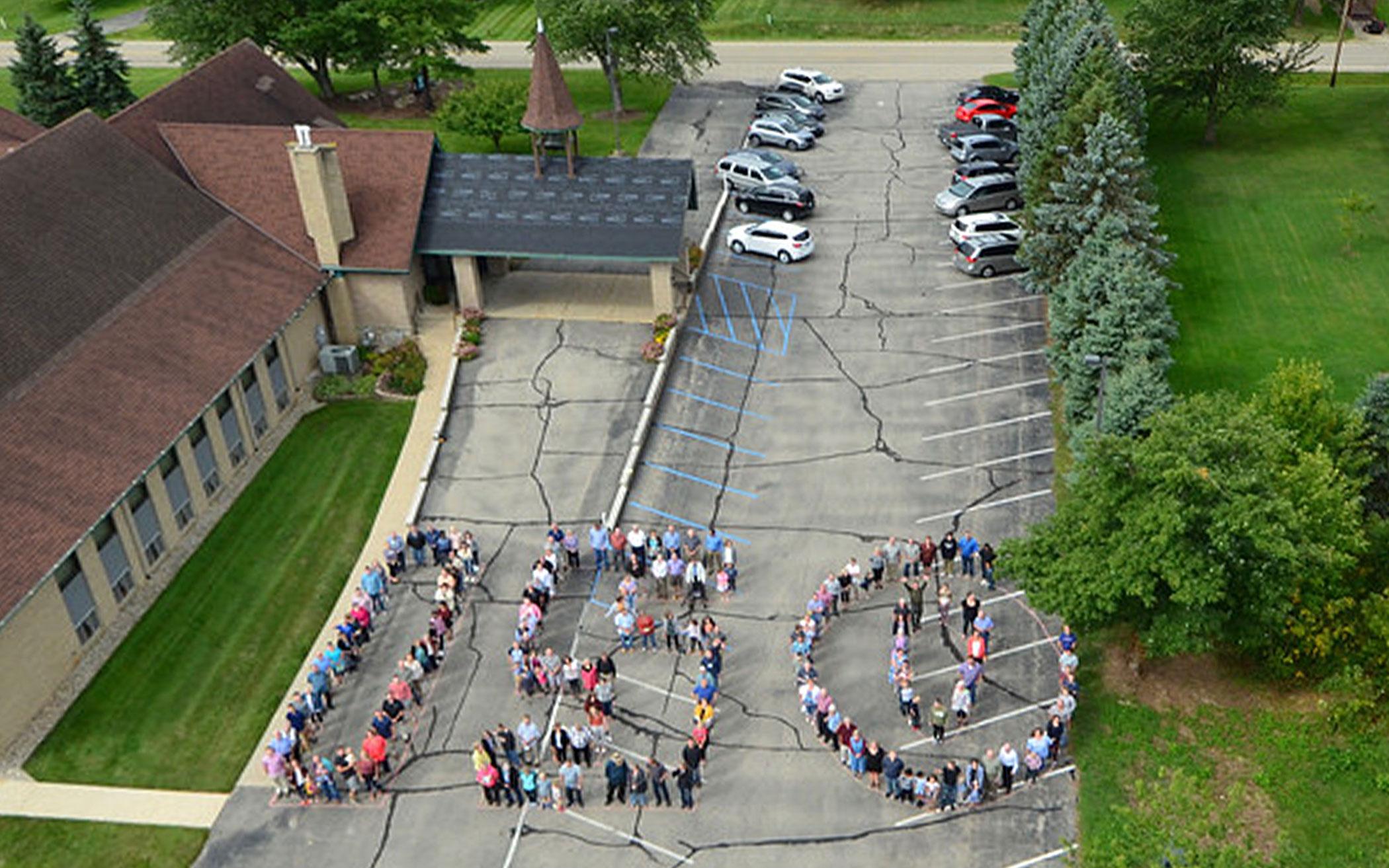 The Saugatuck Fire Department assisted in capturing an aerial photo Aug. 18, 2019, of people in formation in the parking lot of East Saugatuck CRC.
