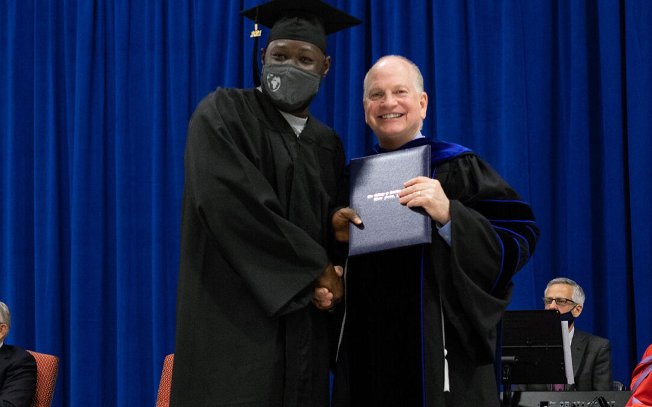 Danny Akin, right, poses with a graduate during the College at Southeastern graduation ceremony Dec. 15, 2021, at Nash Correctional Institution in Nashville, N.C. Photo courtesy of Southeastern Baptist Theological Seminary in Wake Forest, N.C.