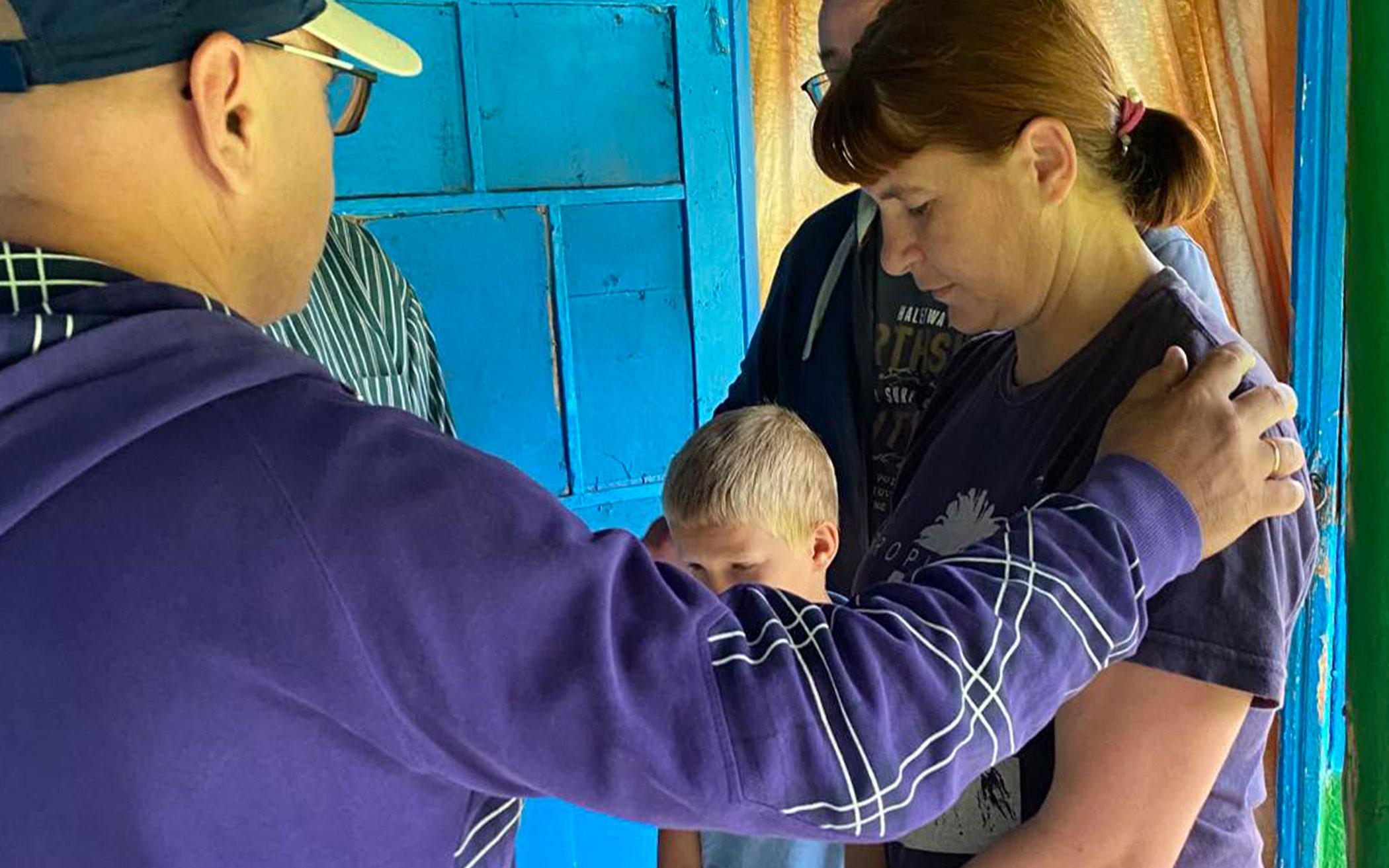 Members of ReFrame’s Russian ministry team pray for members of a community in Moldova.