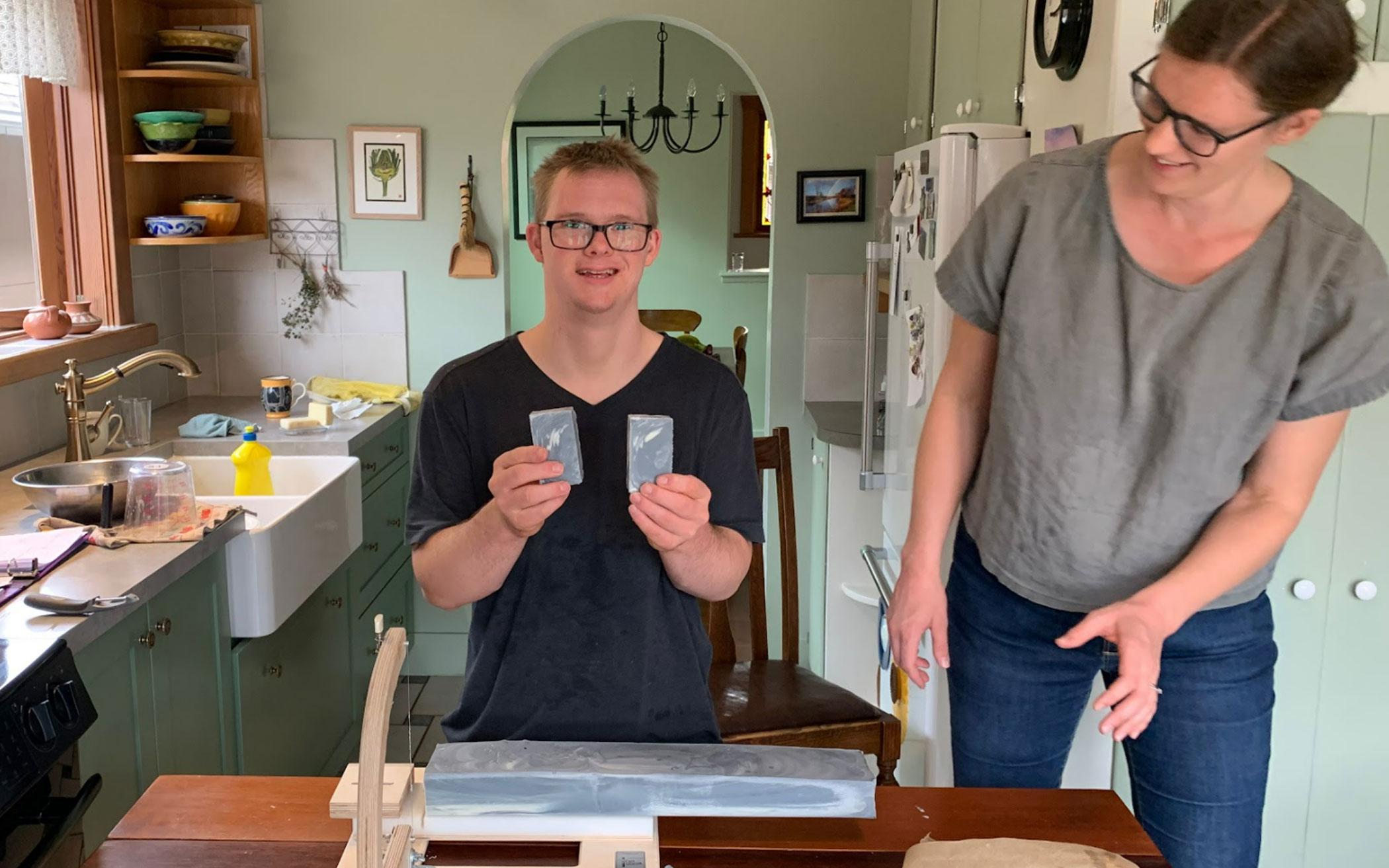 Simon Vanderloo displays freshly cut bars of handmade soap, with his sister, Caroline Short.