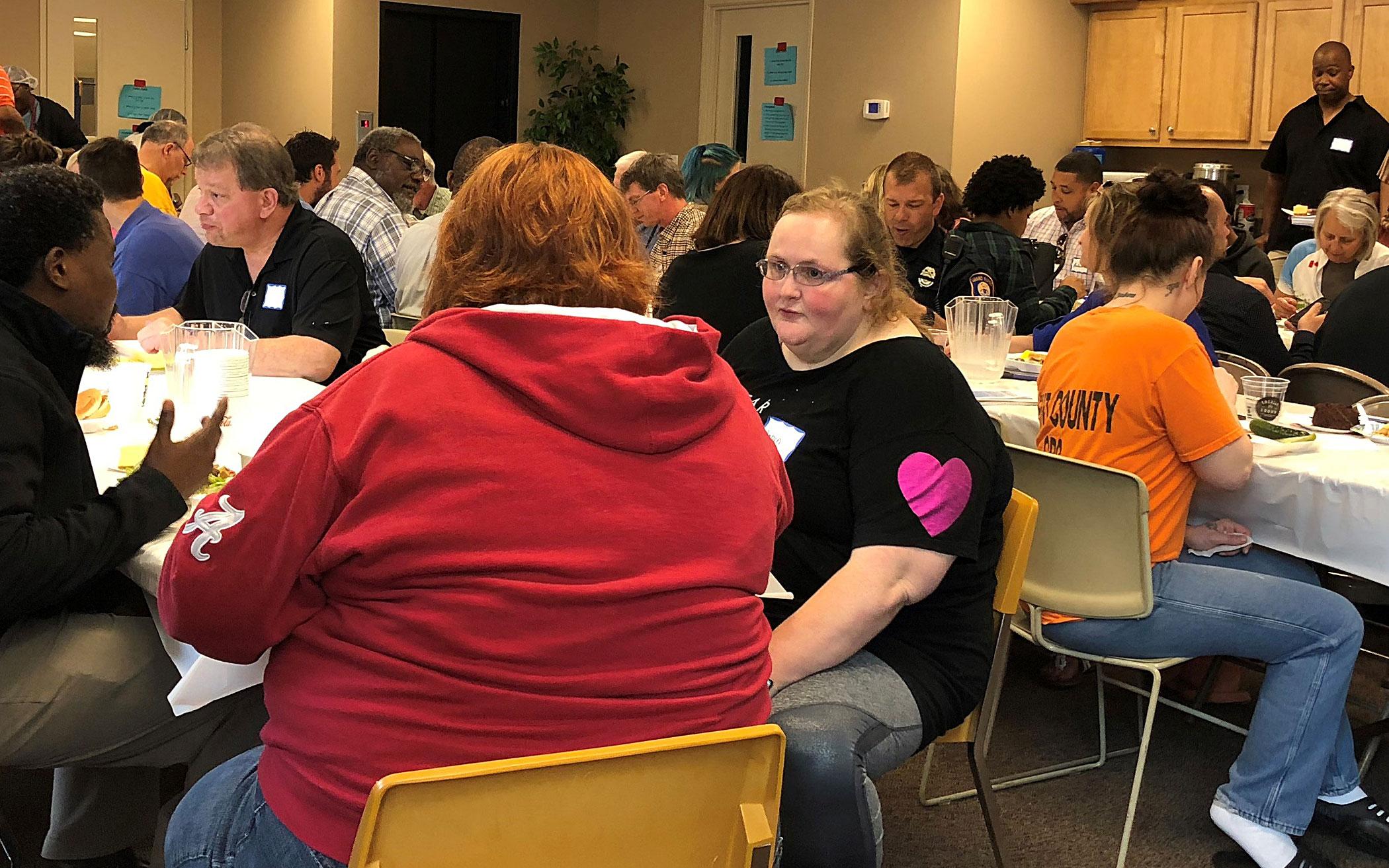 Attendees of the re-entry networking lunch enjoying a meal together in Oakdale Park CRC’s ministry center.