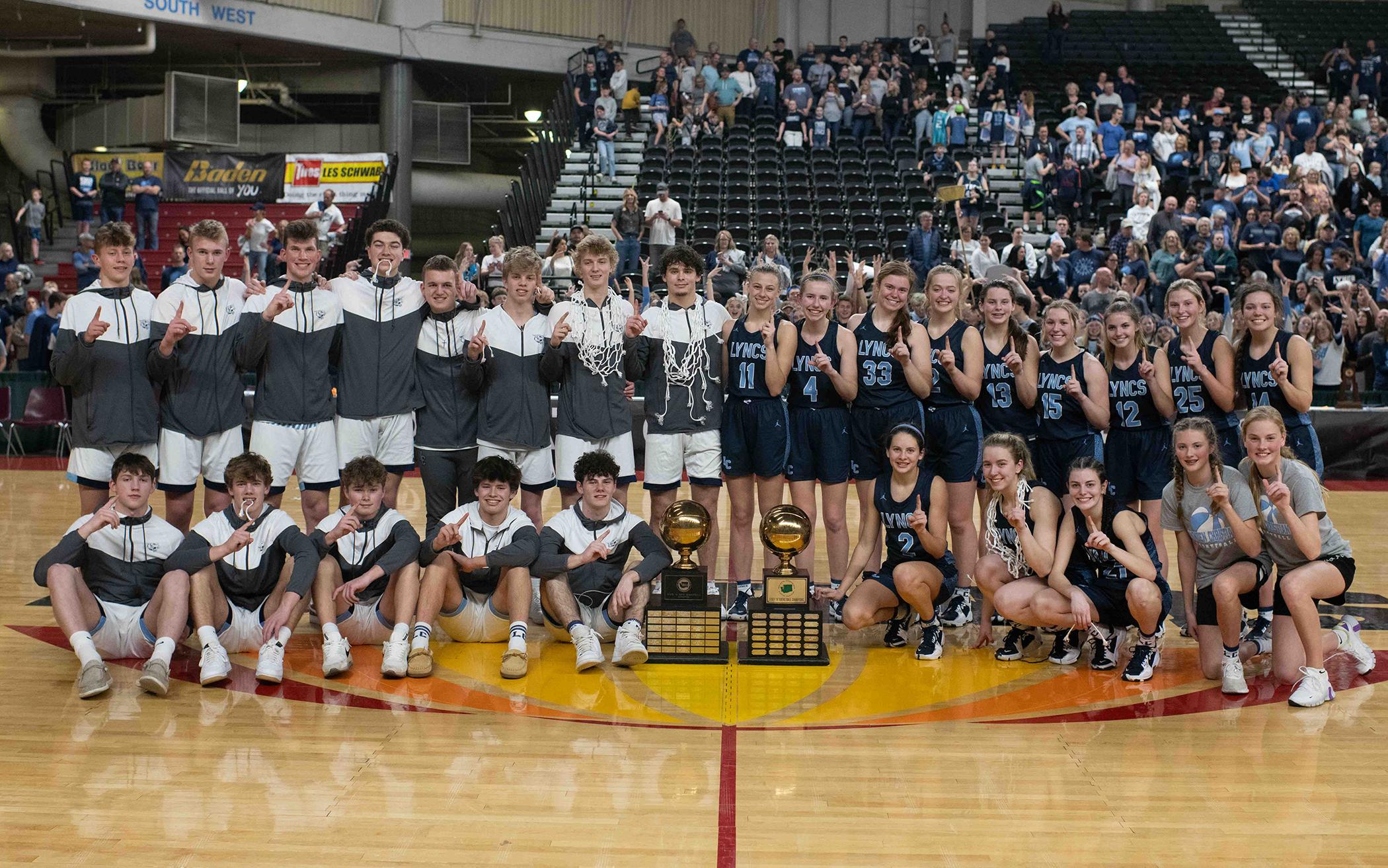 Lynden Christian High School’s boys and girls basketball teams after their championship wins.