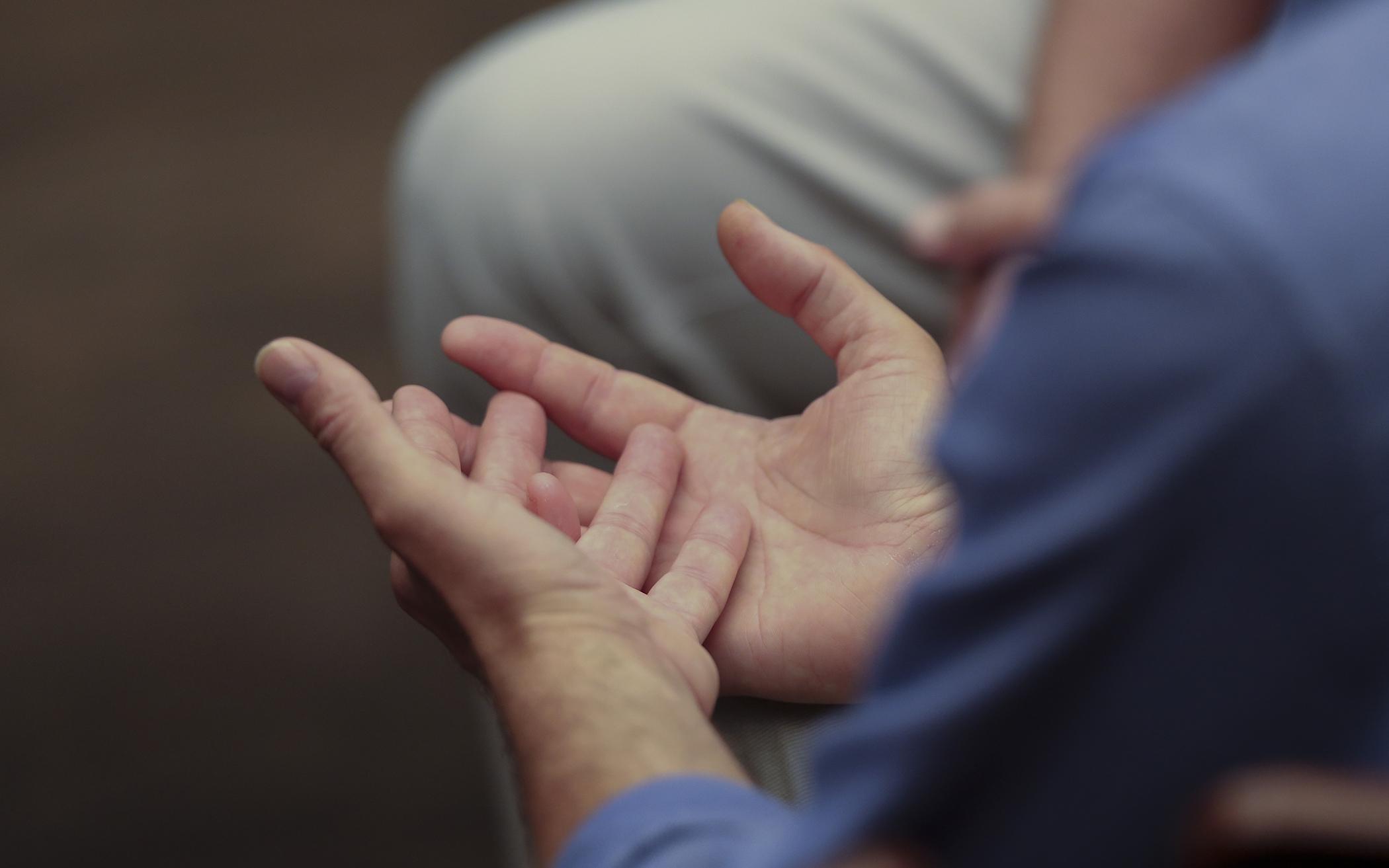 Hands in prayer, during Synod 2022.