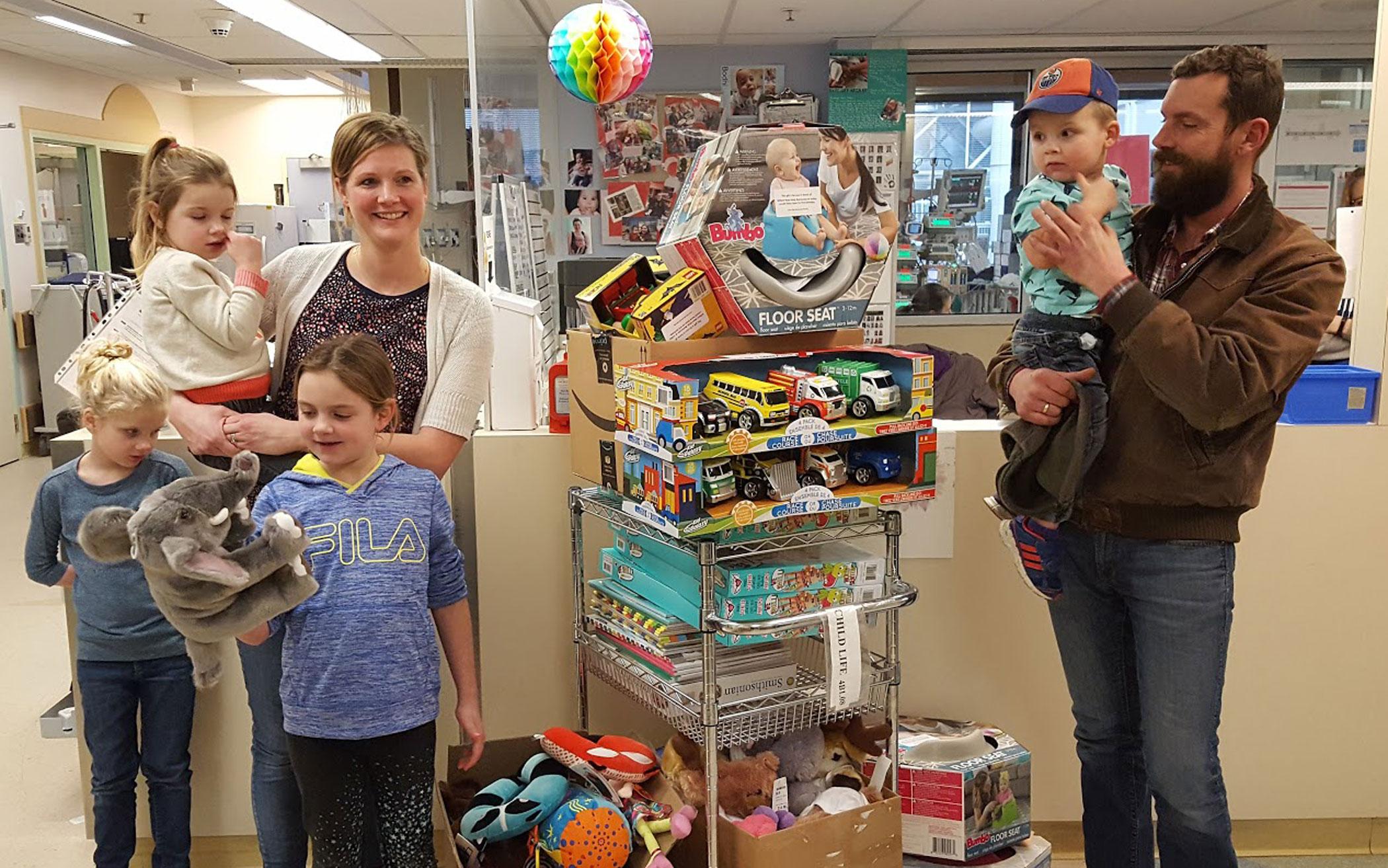 Aarnoutse family at Stollery Children’s Hospital with toys to deliver in honor of Willem.