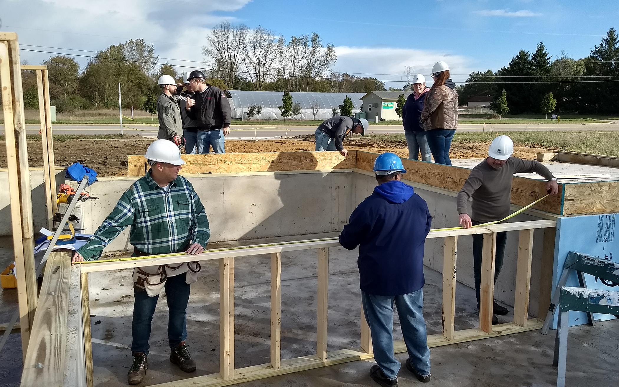 Members of Classis Georgetown serve as volunteer construction workers to complete the Jenison, Mich., home.