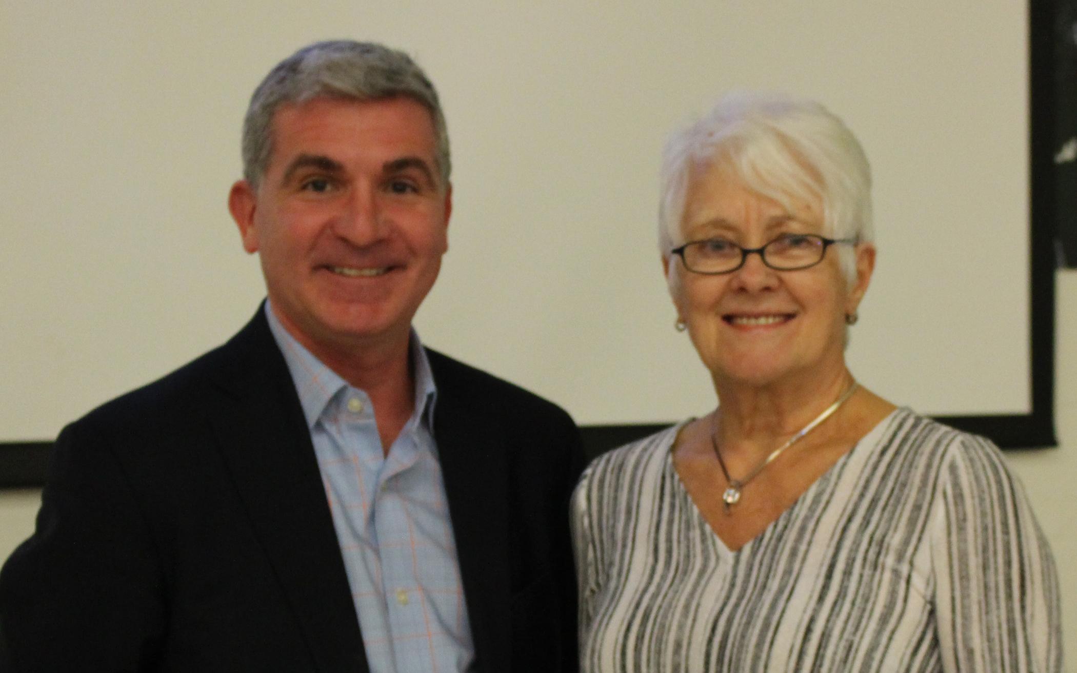 Henny Drope receives Peace Medallion from YMCA of Southwestern Ontario CEO Andrew Lockie.