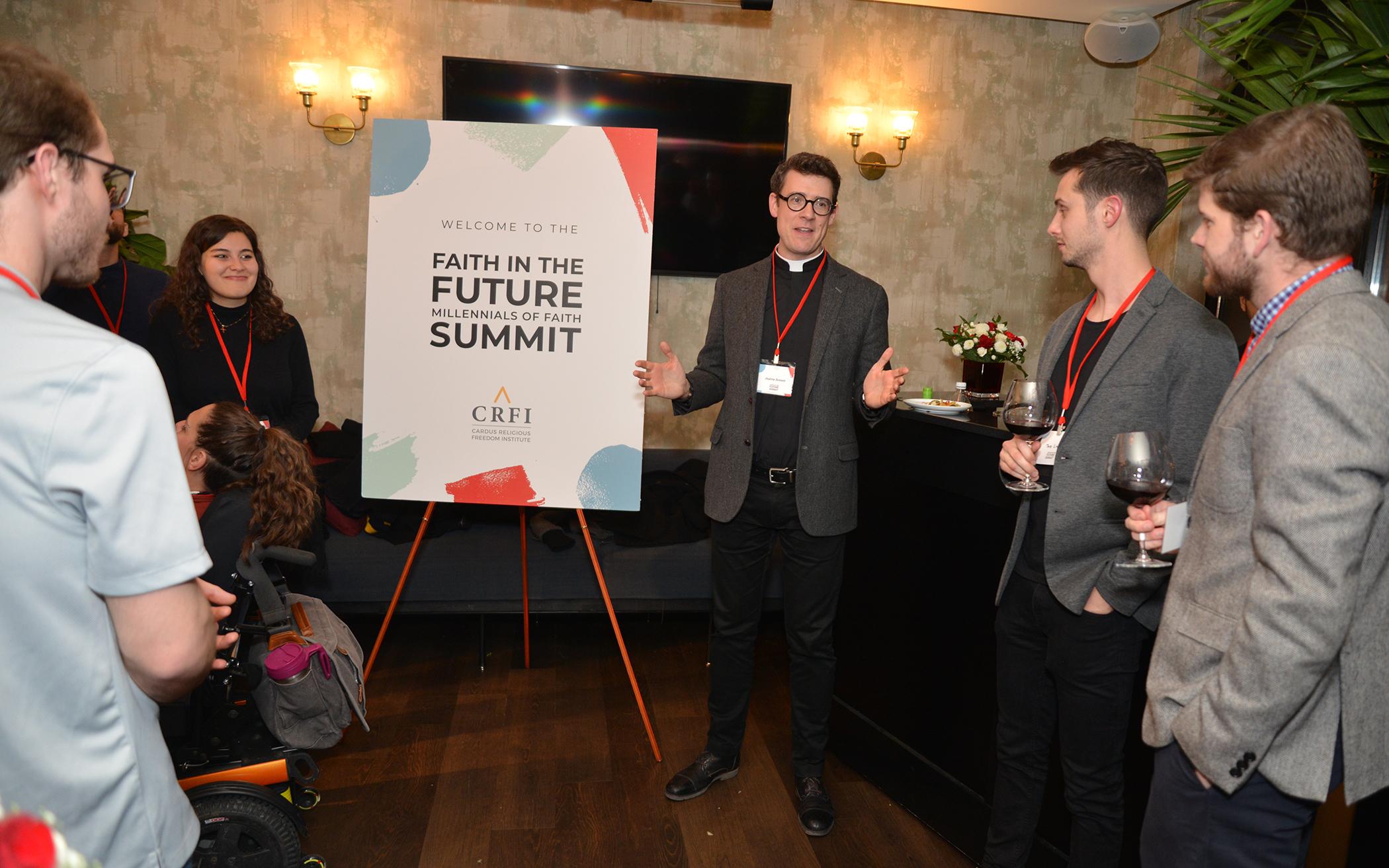 Andrew Bennett (center), director of the Cardus Religious Freedom Institute, welcomes participants to the first Faith in the Future summit in November 2019.