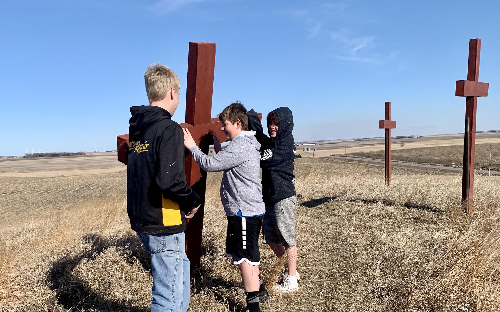Cadets Andrew, Alex, and Jonathan from Ocheyedan (Iowa) CRC helped to erect the crosses.