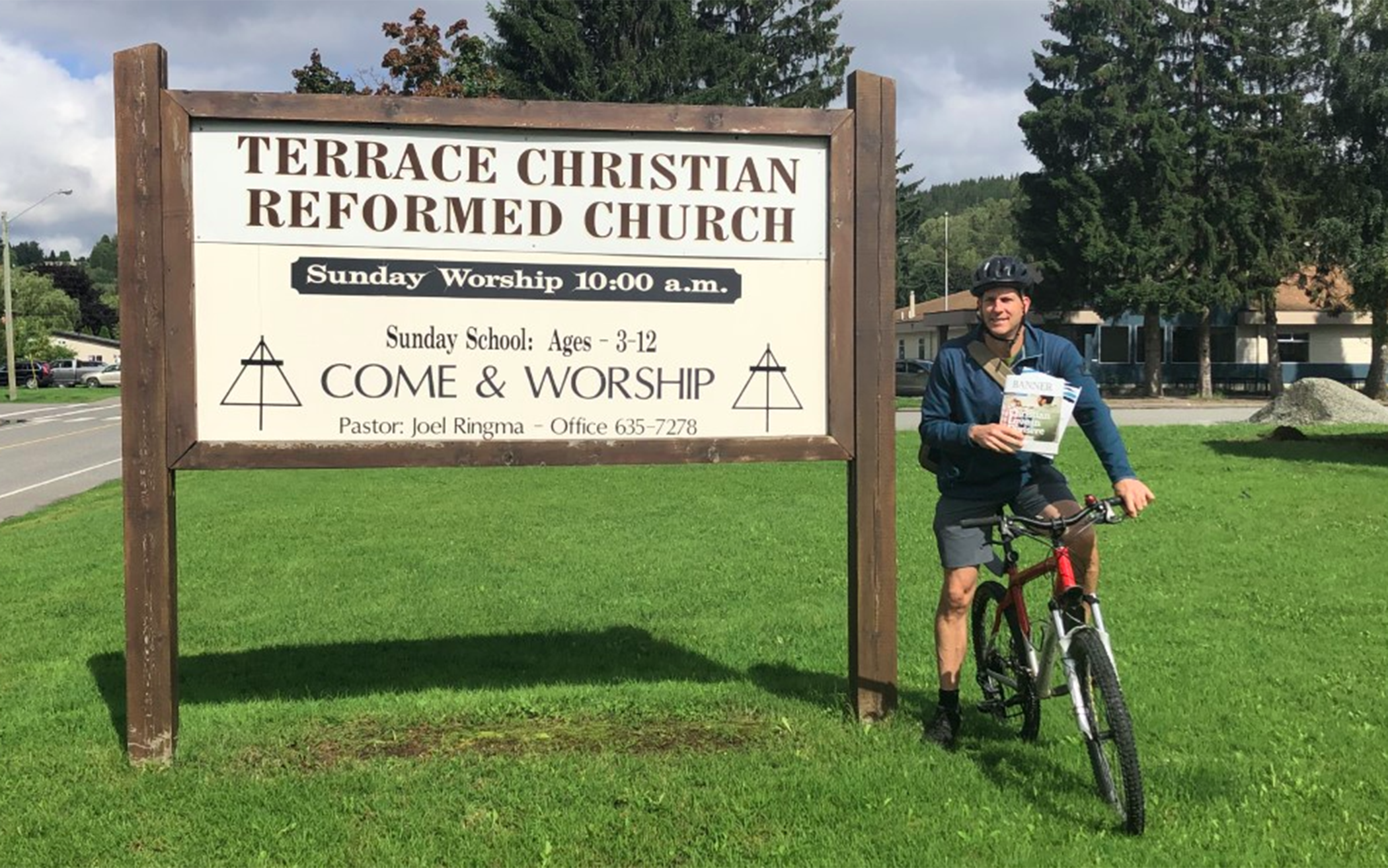 B.C. Pastor Delivers Banner, Visits Congregants by Bicycle