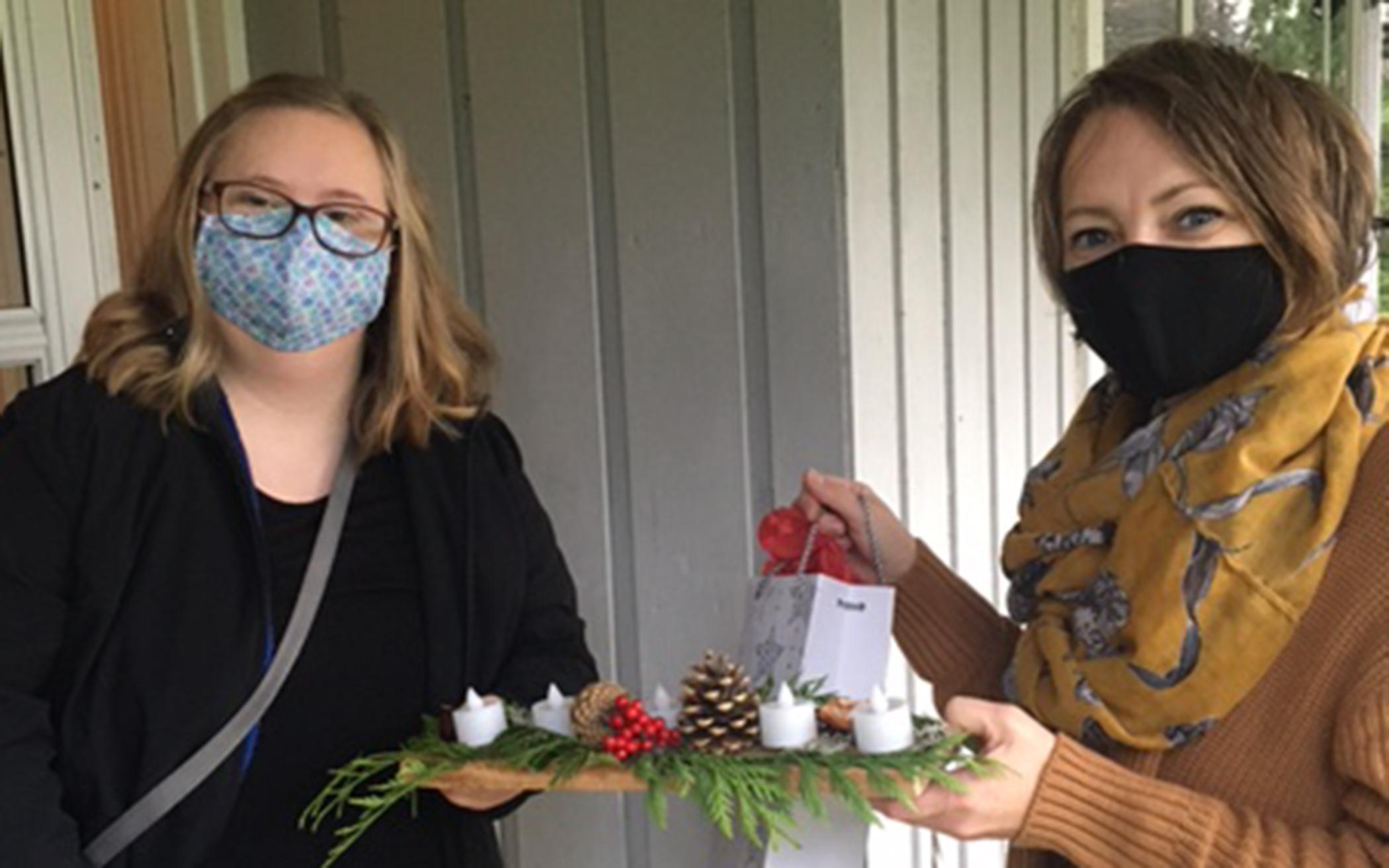 Dianne Kwantes-Mazari (right) delivers an advent package to Mairin, a friend in the Friendship Ministry in Abbotsford, B.C. 