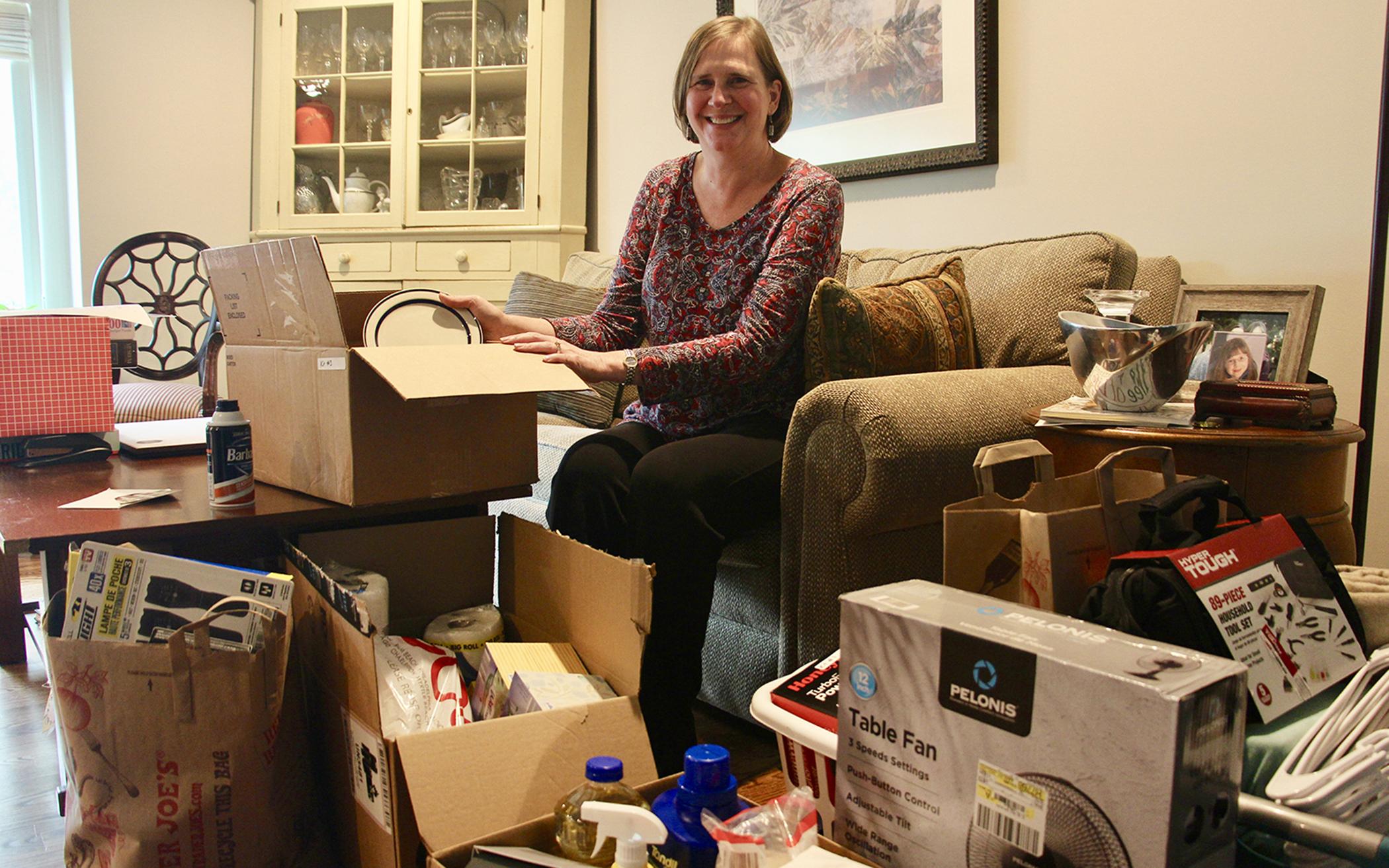 Amy Treier, at her home in the Chicago suburbs, is helping to store donations for World Relief welcome kits collected by members of Immanuel Presbyterian Church in Warrenville, Ill.